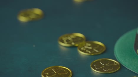 studio shot of green leprechaun top hat and piles of gold coins to celebrate st patricks day 7