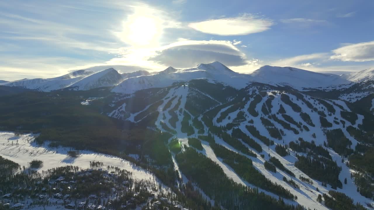 December Breckenridge Ski Resort mountain town Colorado aerial drone sunset Winter December January skiing trails run Peak 9 10 Ten Mile Range Bald Mountain Epic Vail Pass cirrus clouds down motion