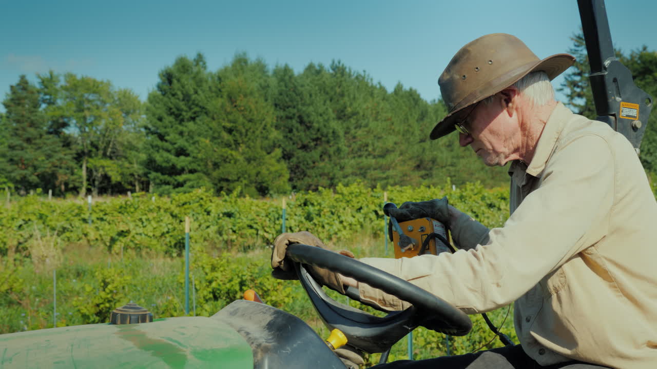 The Farmer In The Hat Works On A Small Tractor