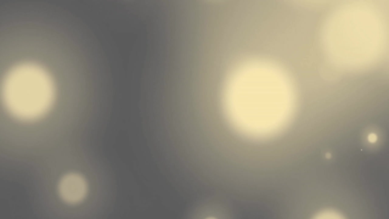 Animation of glowing light spots over grey background