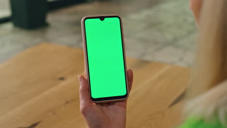 Executive-finger-touching-greenscreen-telephone-at-office.-Woman-swiping-phone