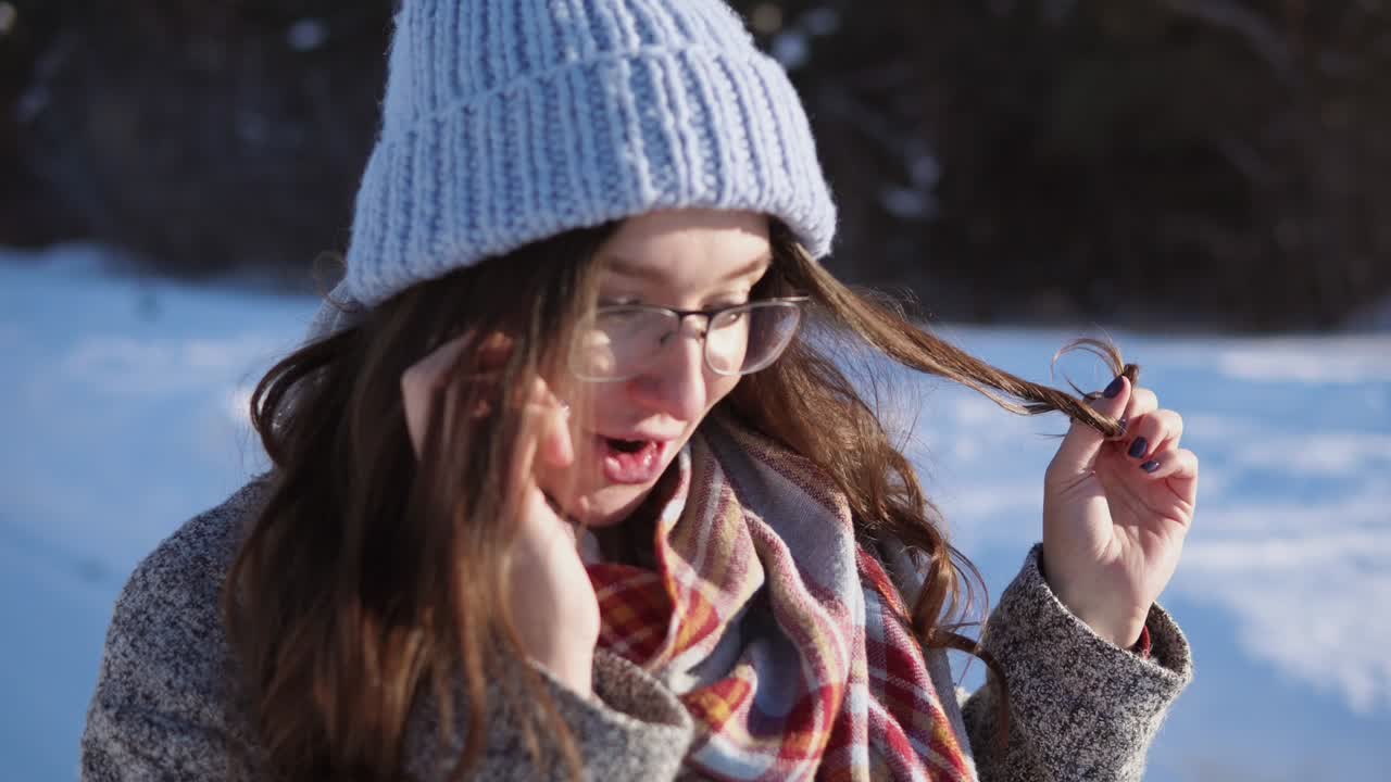 Woman Talking on Phone in Snowy Landscape