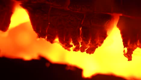 4k macro close up of glowing embers in fire