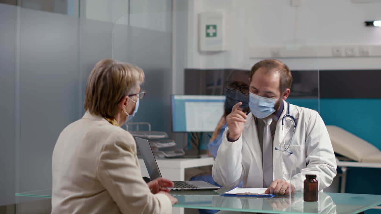 Male physician taking notes on checkup files to give prescription