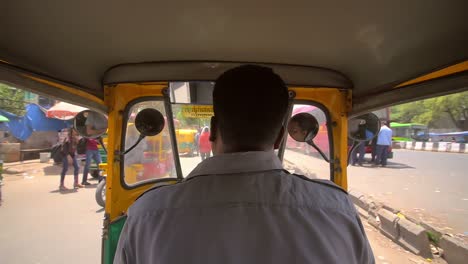 pov inside of a tuk tuk on busy road