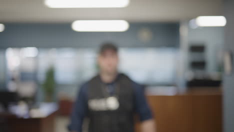 Police-officer-stepping-into-frame-slow-motion