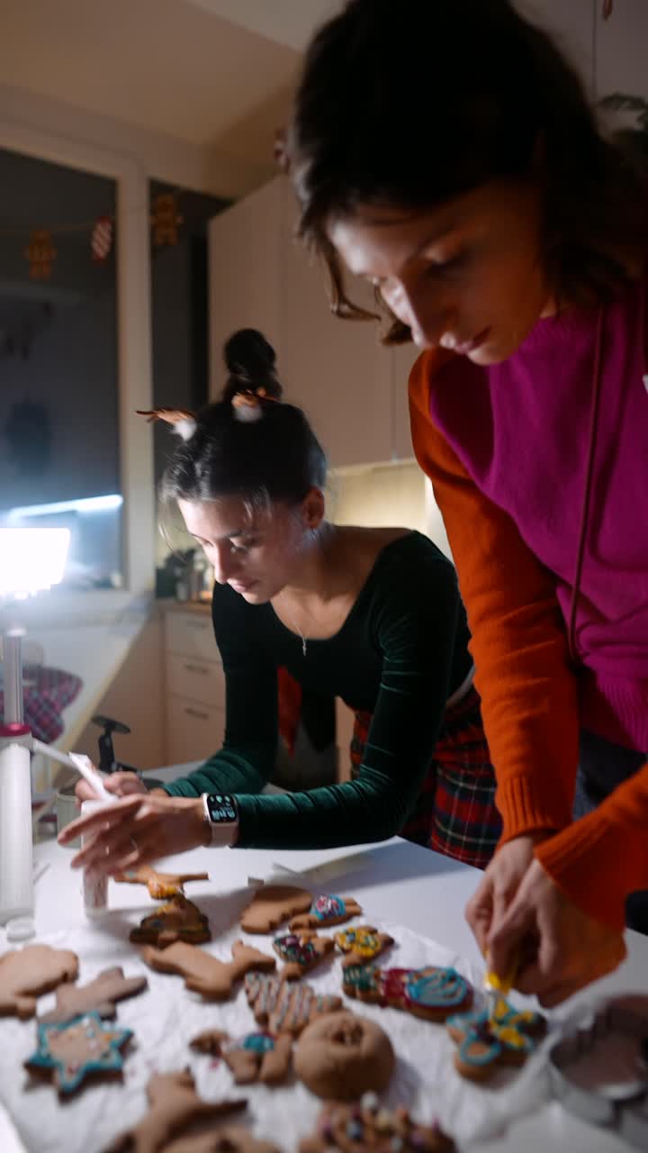 Women Decorating Holiday Gingerbread Cookies