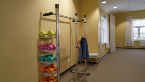 home gym or exercise room with dumbbells and weights