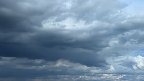 dramatic dark cloudscape covering the sky. low angle view at the clouds gathering in the atmosphere