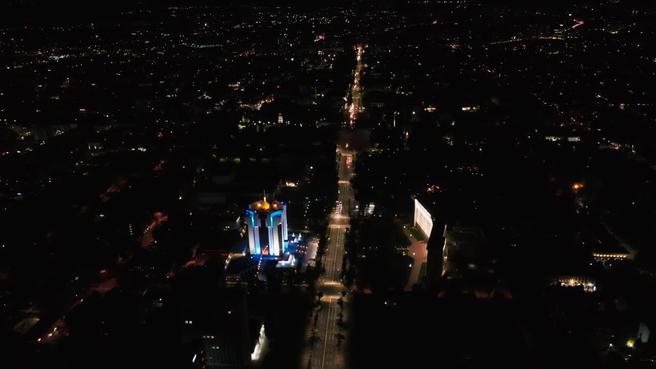 Aerial drone view of Chisinau downtown at night. Parliament, Presidency, road with moving cars and illumination. Moldova