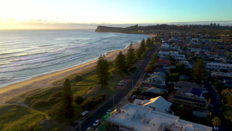 Beautiful-Lennox-head-drone-shot,-town,-beach-and-ocean