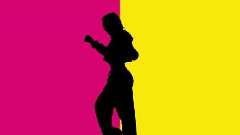 studio silhouette of woman dancing against yellow and pink backgrounds