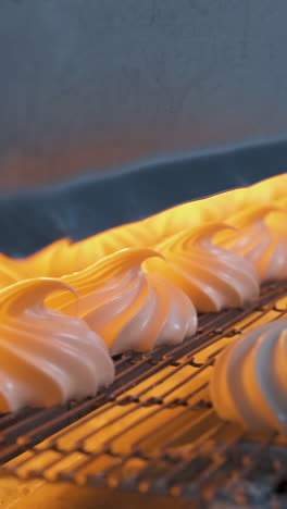 automatic feeding of marshmallows on a conveyor to an infrared oven for drying. confectionery factory. vertical video