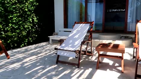 panning shot of hammock chairs outside a resort in kiwengwa, tanzania