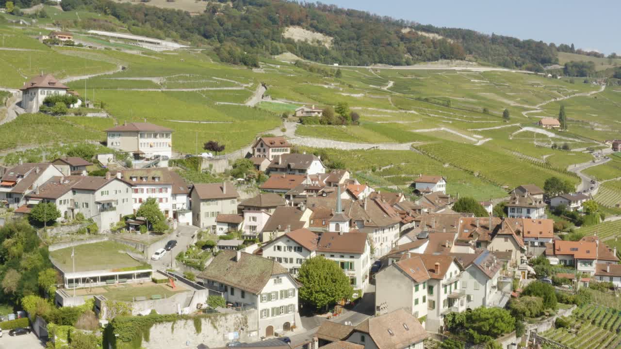 Aerial orbit around typical village in Lavaux vineyard - Switzerland