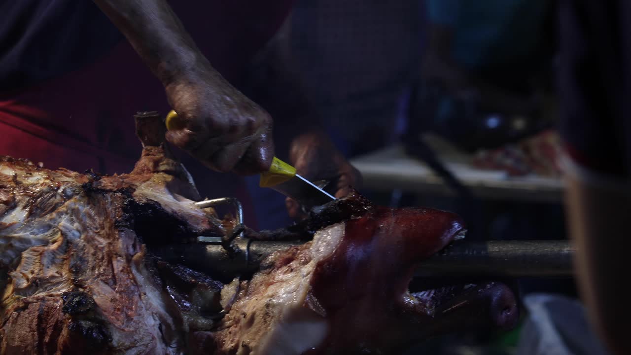 Street Food. Pork being cooked over hot charcoal fire