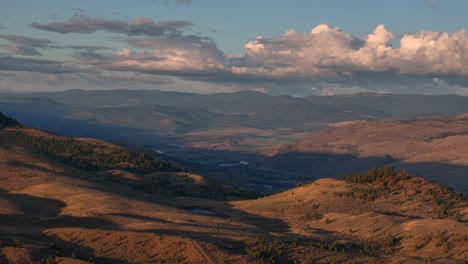 Dusk's-Embrace:-Aerial-Glimpse-of-Sunset-Over-the-Grassy-Desert-Landscape-with-and-Hills