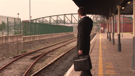 man waiting for train