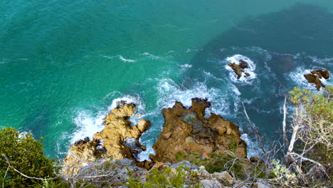 waves crash against jagged coastline - top view from lookout point, the heads