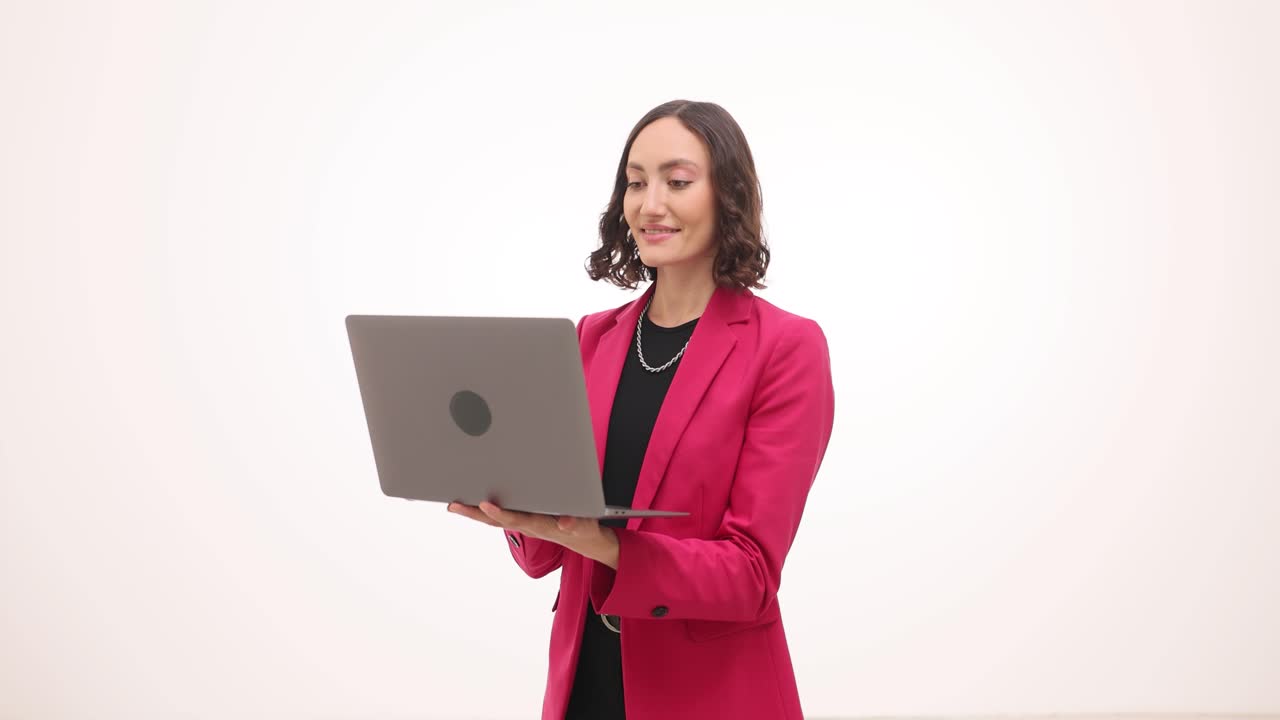 Professional Woman Engaging in a Virtual Meeting with Laptop