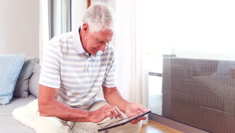 Senior-man-using-tablet-pc