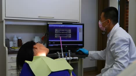 male dentist interacting with patient 4k