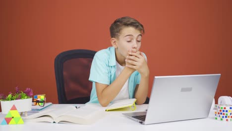 Boy-looking-at-laptop-in-amazement.