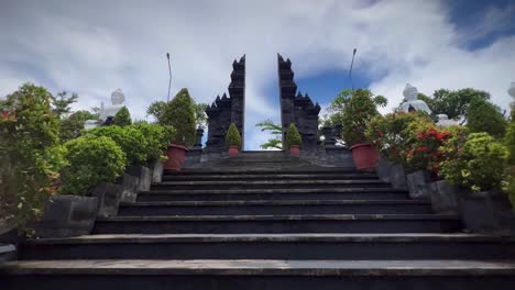 walking on the steps on the buddhist temple in brahmavihara-arama, indonesia