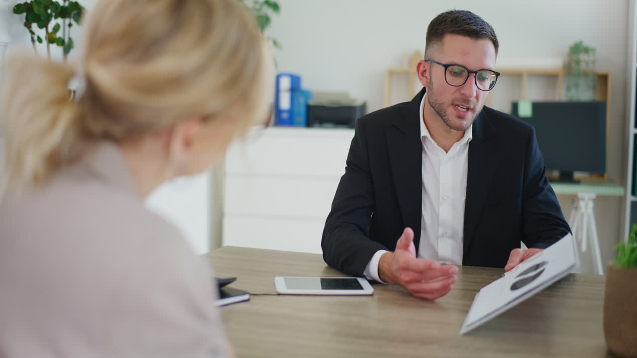 Real Estate Agent Presents Offer to Client