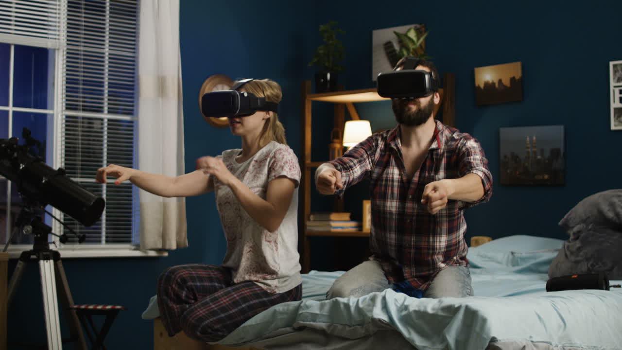 Couple enjoying virtual reality experience at home