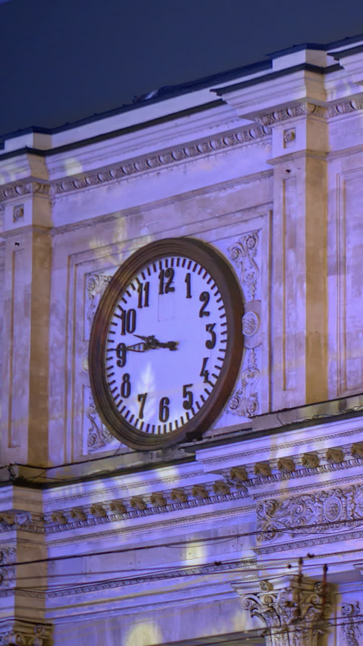 Chisinau, Moldova - December 24, 2024: Snowflakes projection on the Triumphal Arch in the evening. Vertical