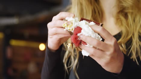 woman having cake in cafe 4k