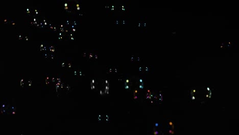 vivid bubbles drift in a dark, mysterious space