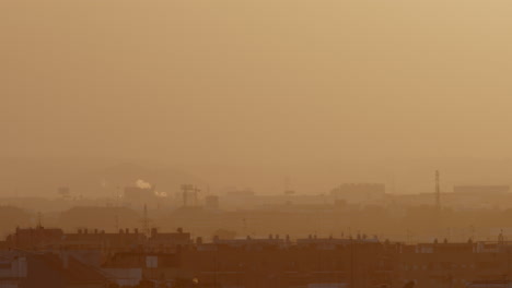 cityscape at sunrise/sunset with smog