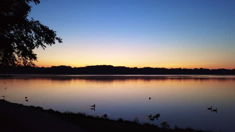 aerial view of sunrise over reeds lake in michigan, usa