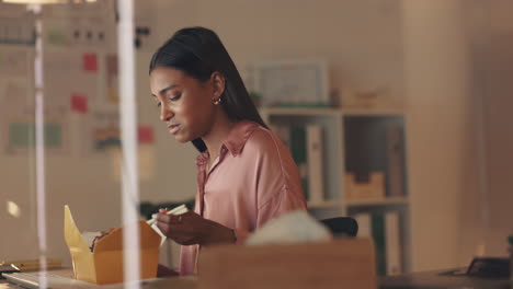 woman, working late night and eating fast food