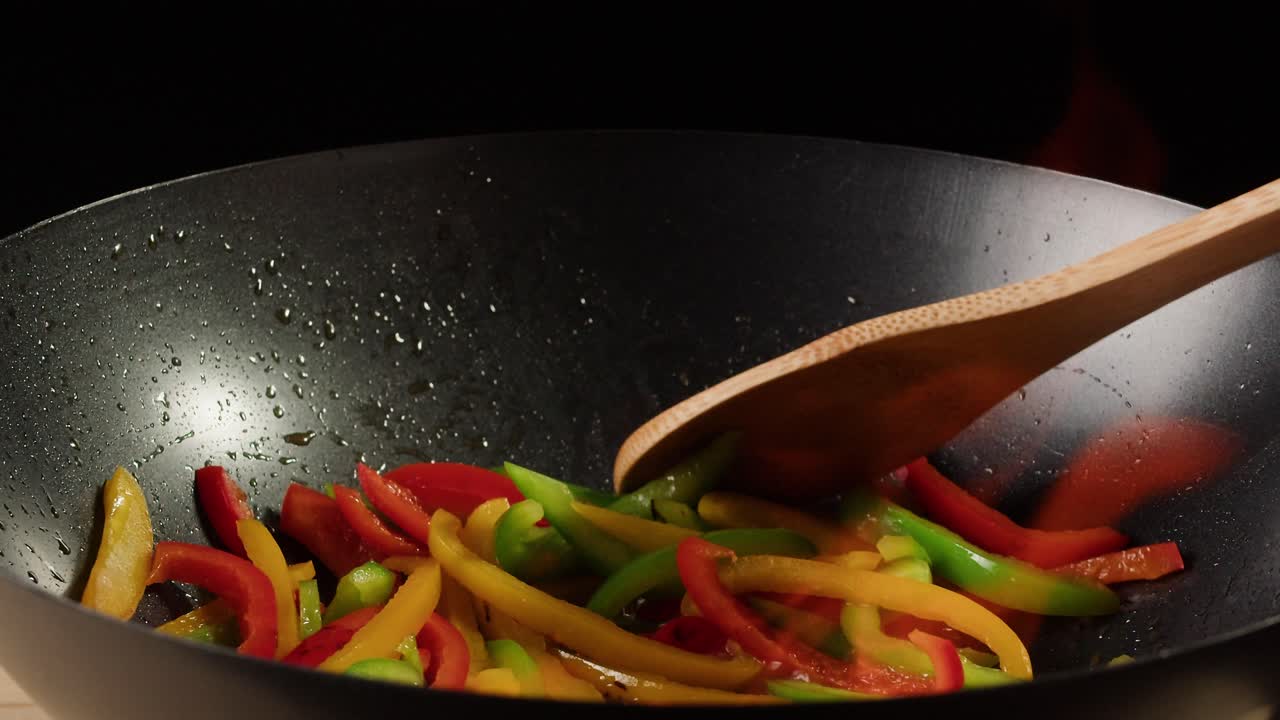 Stir-Frying Colorful Bell Peppers in a Wok