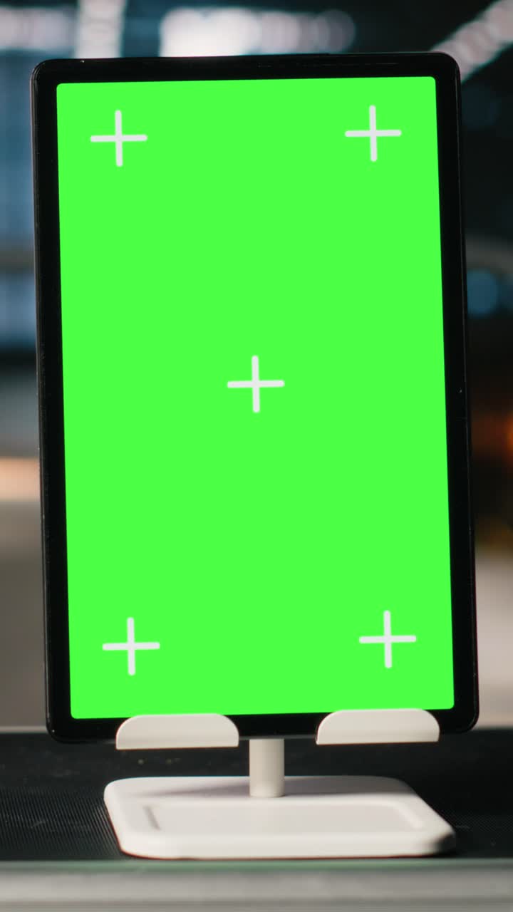 Vertical Video Vertical green screen on tablet in empty industrial factory
