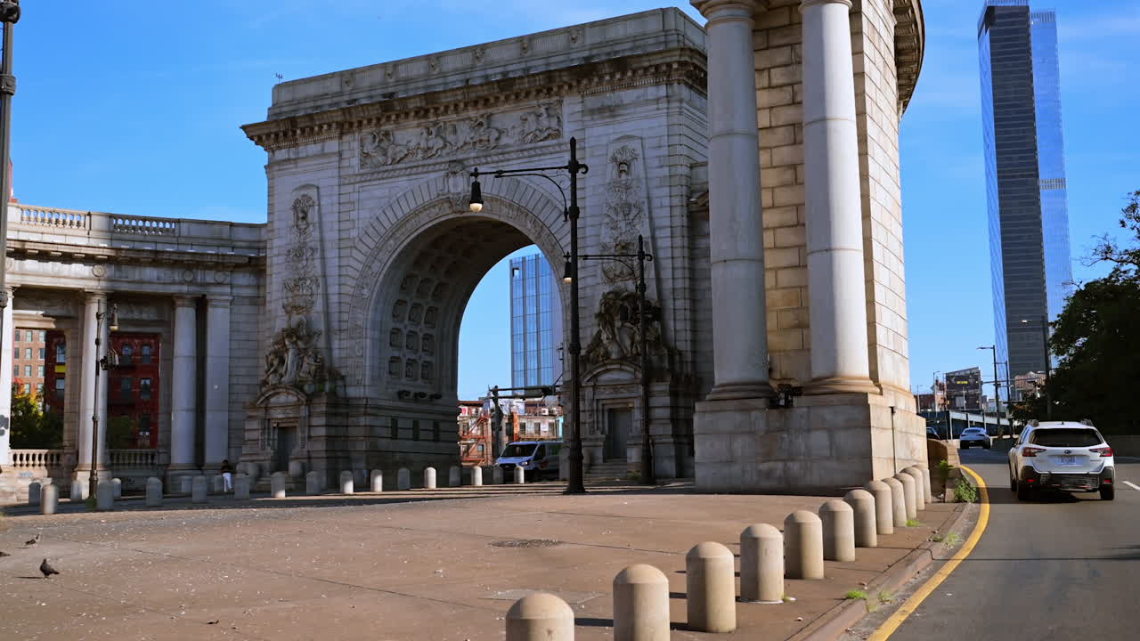 New York, USA, 9 August 2025: Manhattan Bridge Arch and Colonnade with pigeons. Historic Manhattan Bridge Arch and Colonnade in New York surrounded by pigeons and morning sunlight