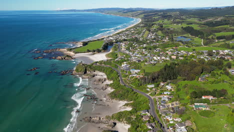 flying over scenic seaside town in brighton, dunedin, new zealand