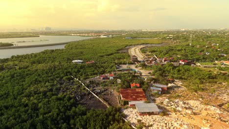 cinematic 4k aerial panorama of lush mangroves, winding coastal roads, and urban skyline at golden hour—symbolizing the balance of nature and development in the philippines
