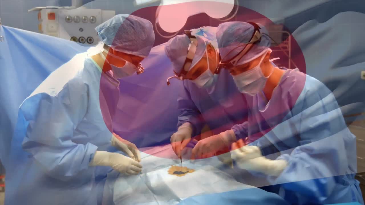 수술실 에서 외과 의사 들 위 에 흔들리는 일본 국기 의 애니메이션