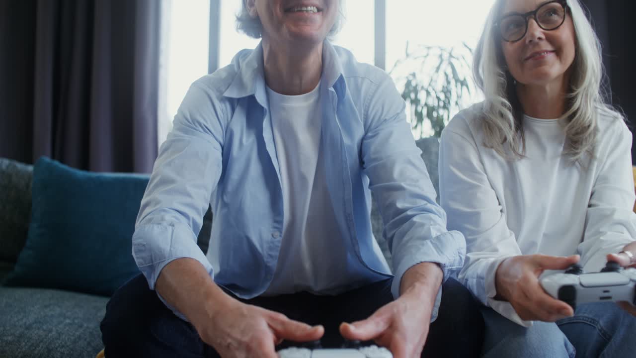 Senior Couple Playing Video Games at Home