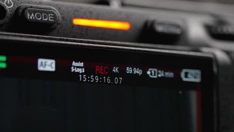close-up of a professional camera's display showing recording details