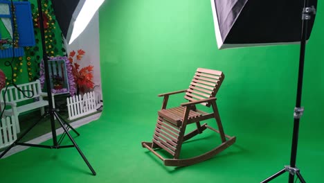 photo or video studio with two hexagone studio lights. green screen and rocking chair