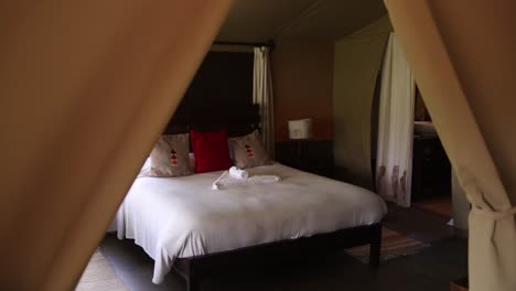 bed in luxury safari canvas tent on safari on the masai mara reserve in kenya africa