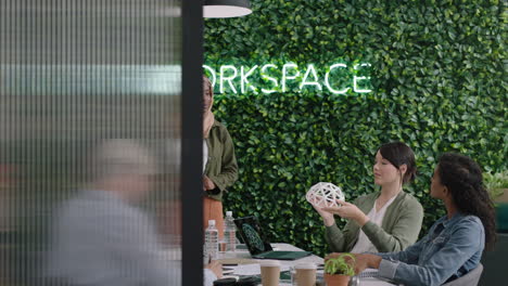 muslim business woman presenting geodesic dome model in office meeting colleagues brainstorming creative design solution discussing engineering ideas in startup presentation