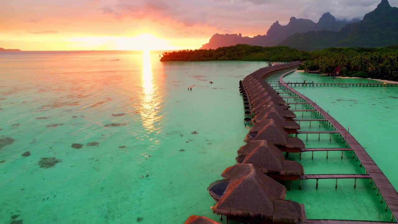 Aerial View of Overwater Bungalows in Bora Bora at Sunset