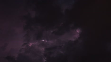 thunderstorm timelapse during a dark night - dark scary weather with lightning clouds