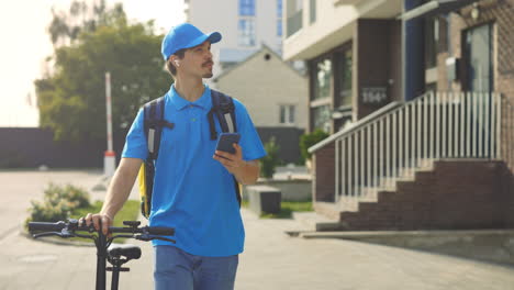 delivery person with scooter in urban environment